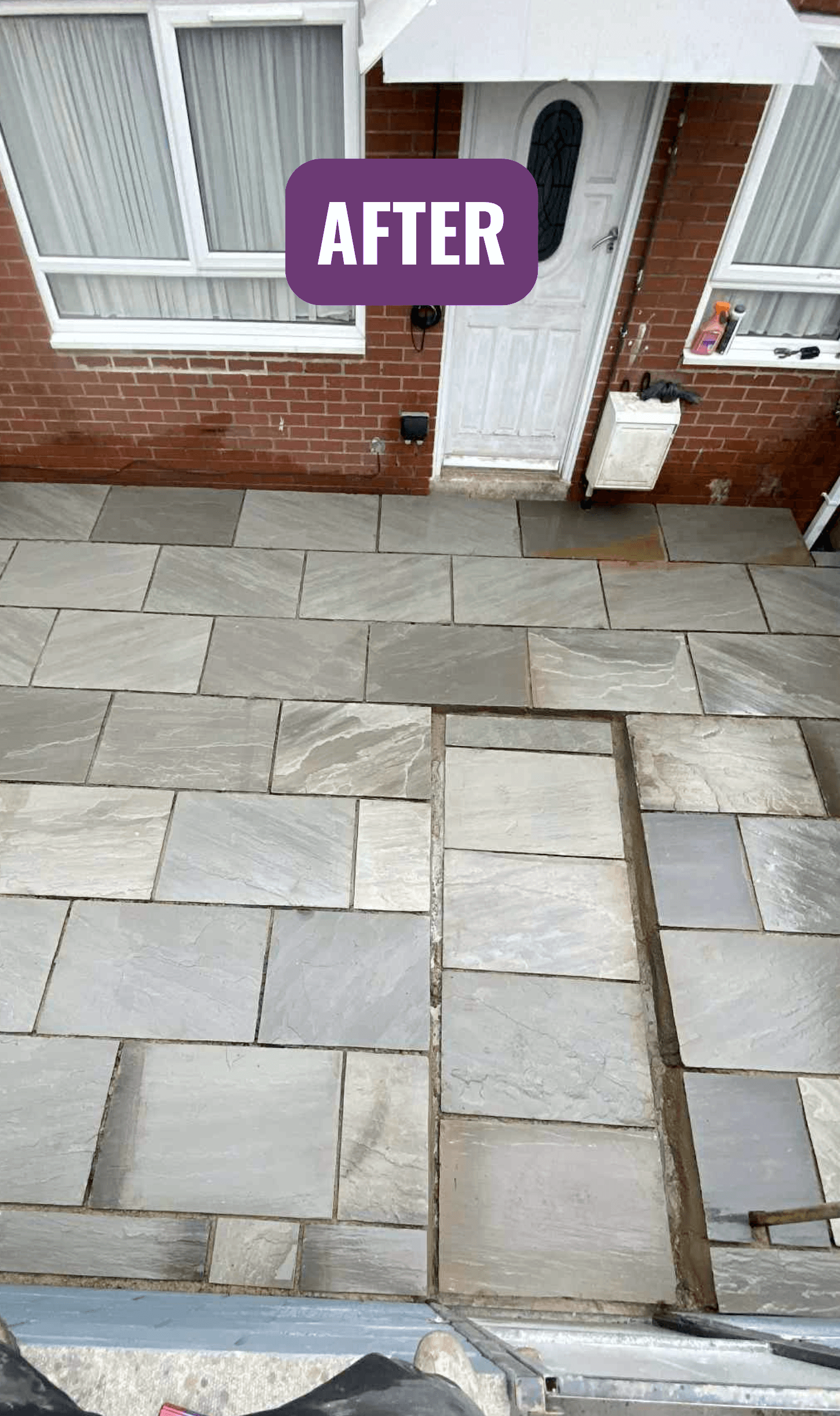 After: the same yard relaid with grey patio slabs